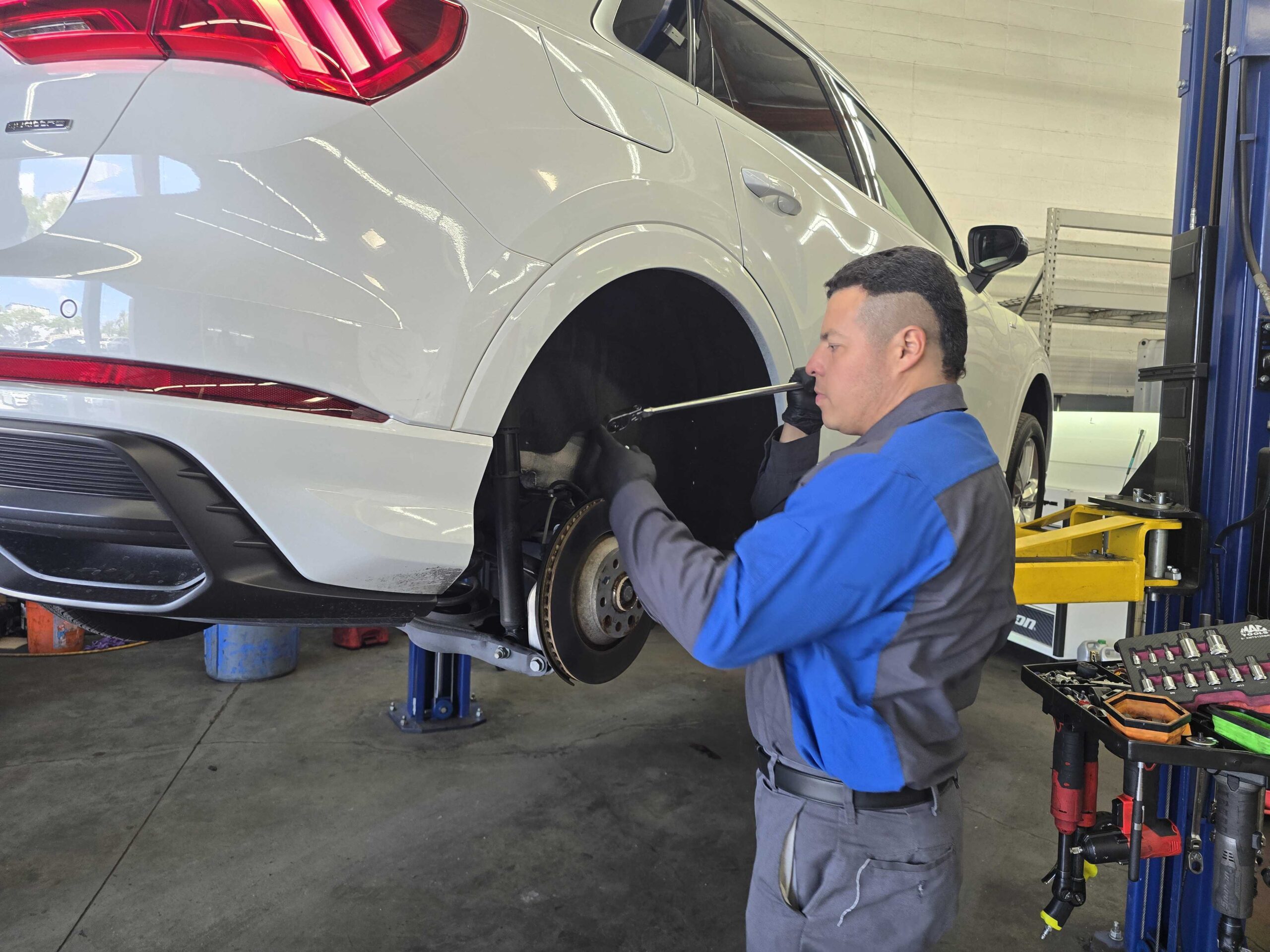 ASE-certified technician performing brake repair at Euro Car Clinic in Signal Hill, CA